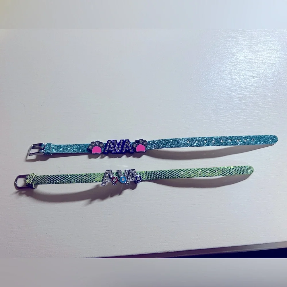 Two girls super cute glitter brackets with name Ava. Gently used